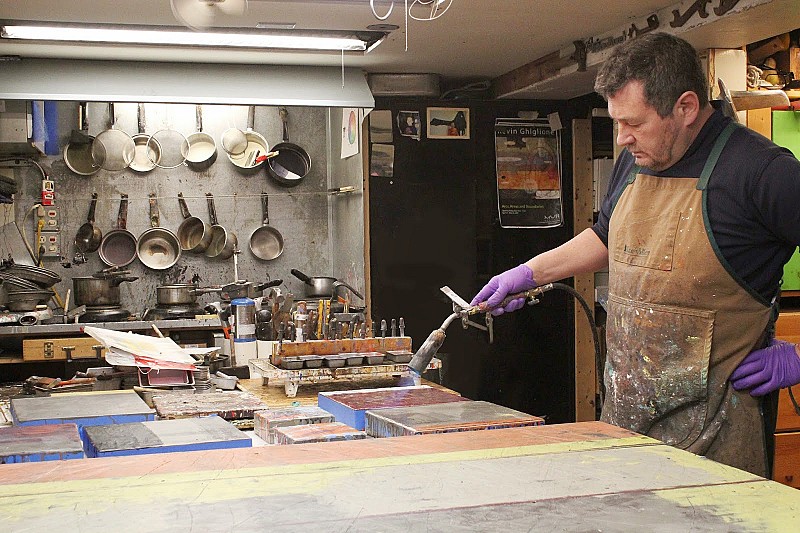 Kevin Ghiglione working on encaustic pieces